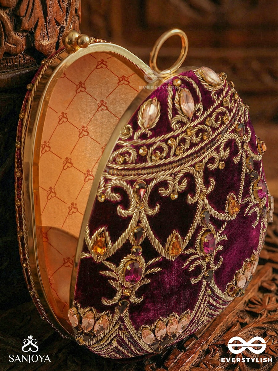 Zeenat – Oval Dark Pink Velvet Clutch With Detailed Embellishment And Golden Metal Frame