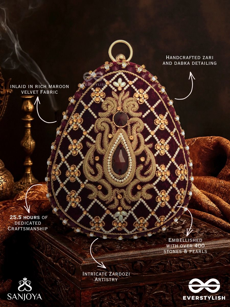 Shahnaz – Oval Maroon Velvet Clutch With Intricate Zardozi Embroidery And Golden Metal Frame