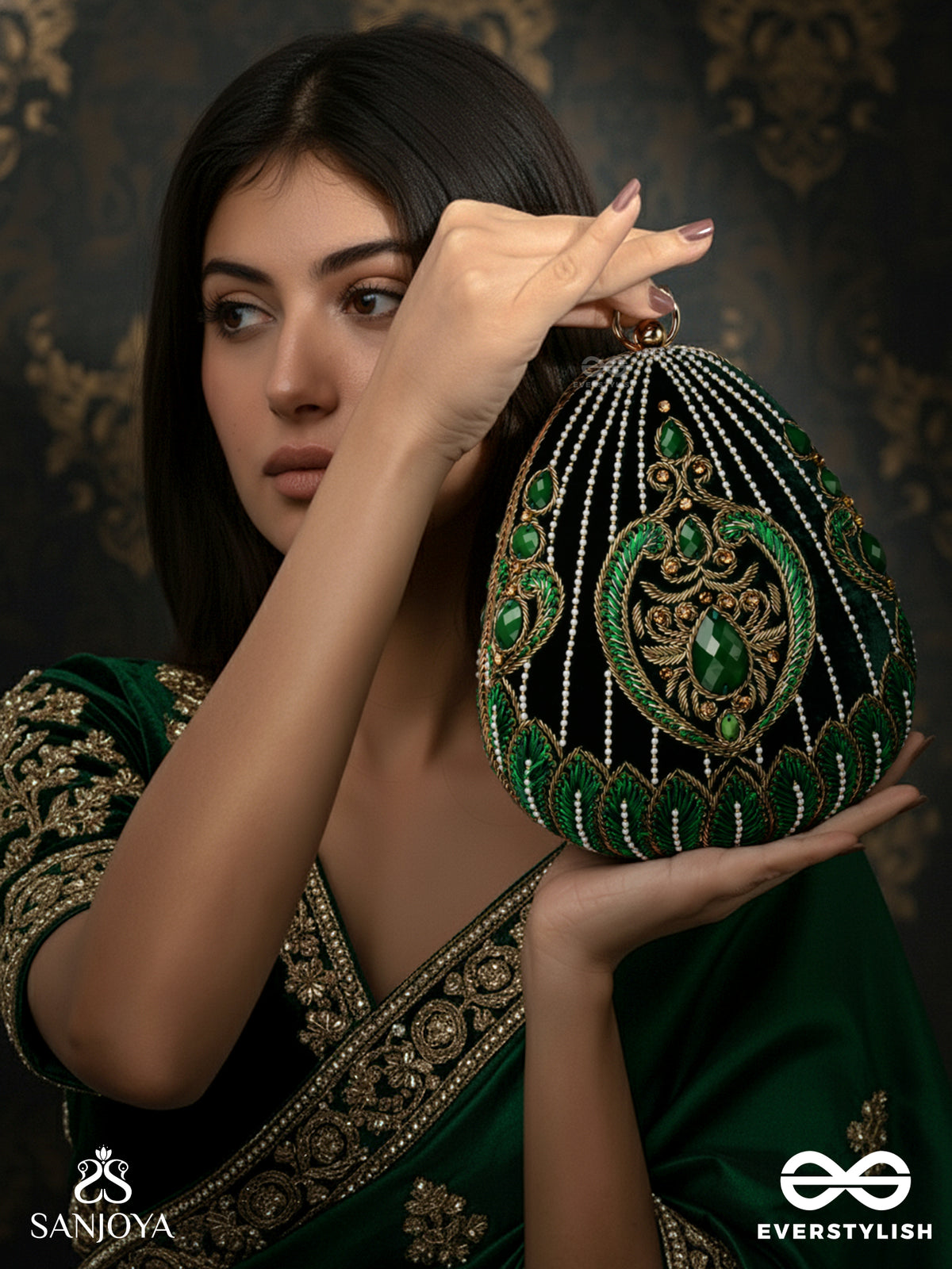 Mehreena – Oval Dark Green Velvet Clutch With Intricate Handwork And Golden Metal Frame
