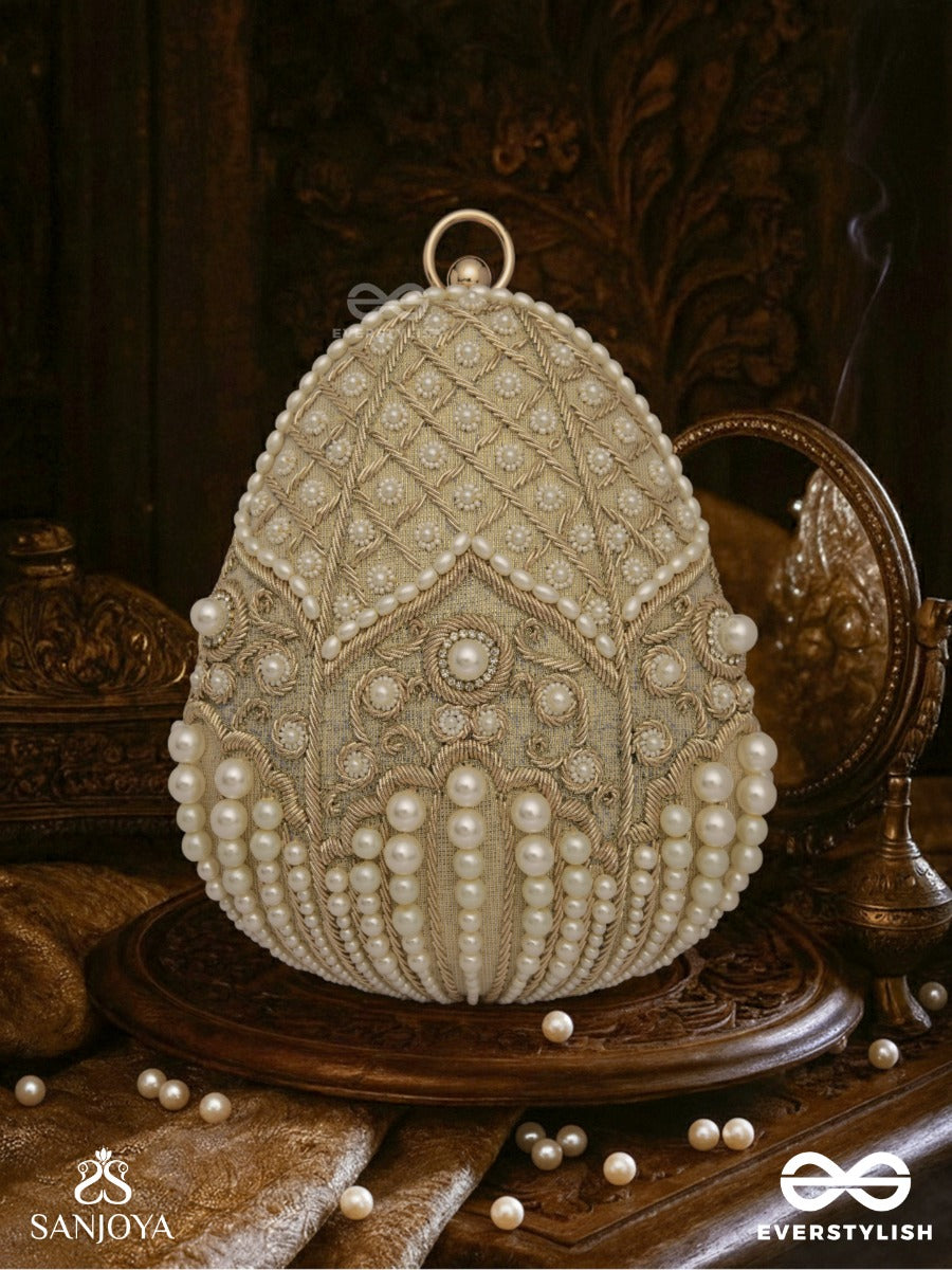 Sahiba  – Oval Ivory Silk Clutch With Pearl Embedding And Golden Metal Frame