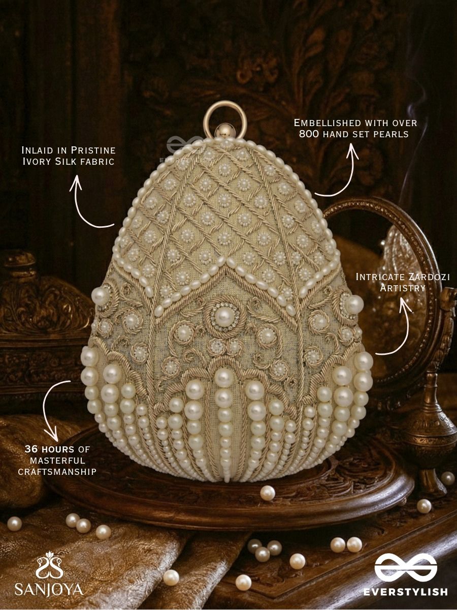 Sahiba  – Oval Ivory Silk Clutch With Pearl Embedding And Golden Metal Frame