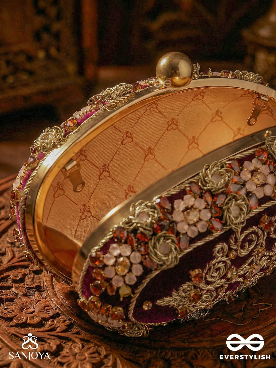 Zevariya – Heirloom-Style Oval Clutch With Intricate Zari Detailing And Golden Metal Frame