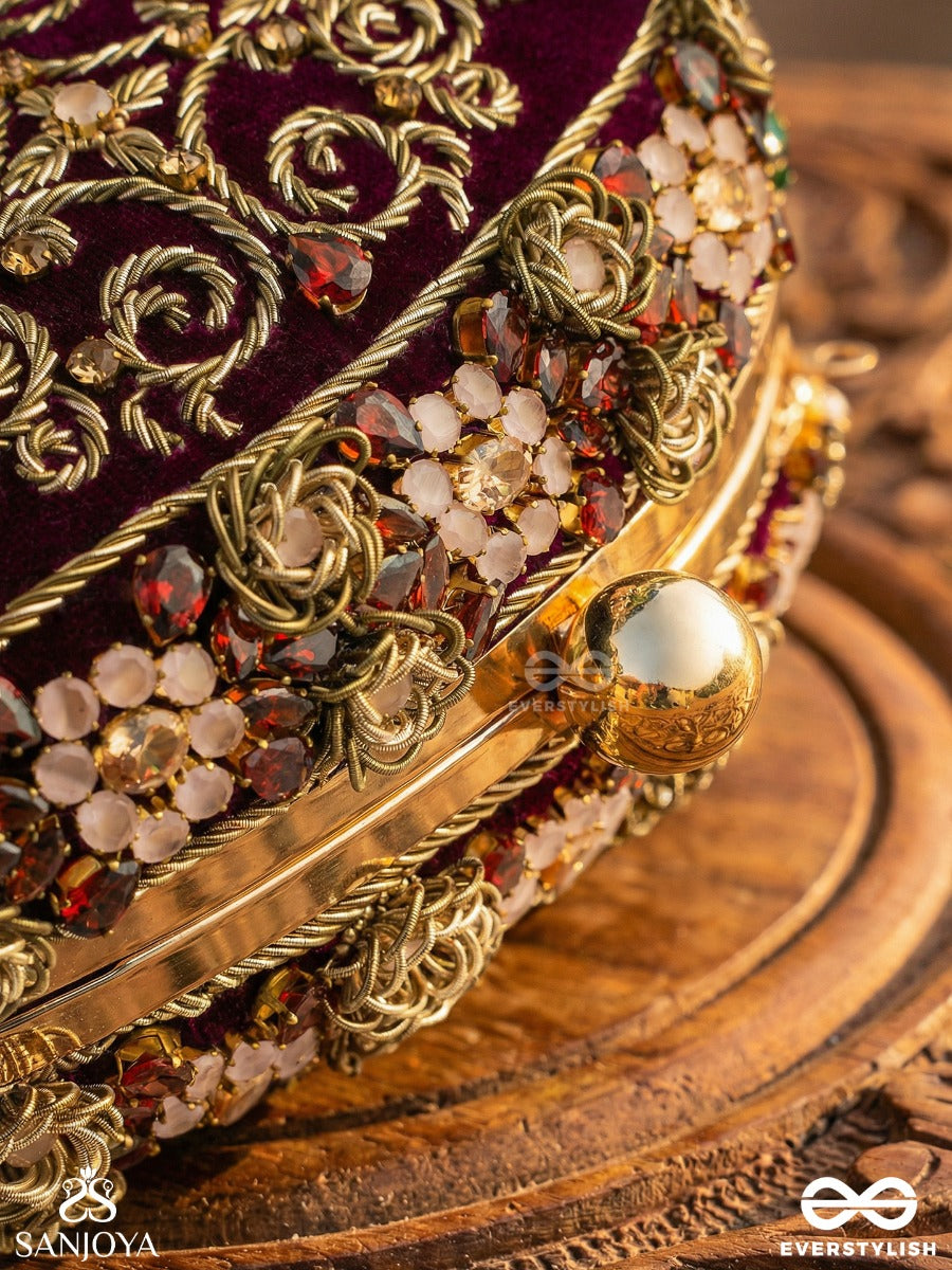 Zevariya – Heirloom-Style Oval Clutch With Intricate Zari Detailing And Golden Metal Frame