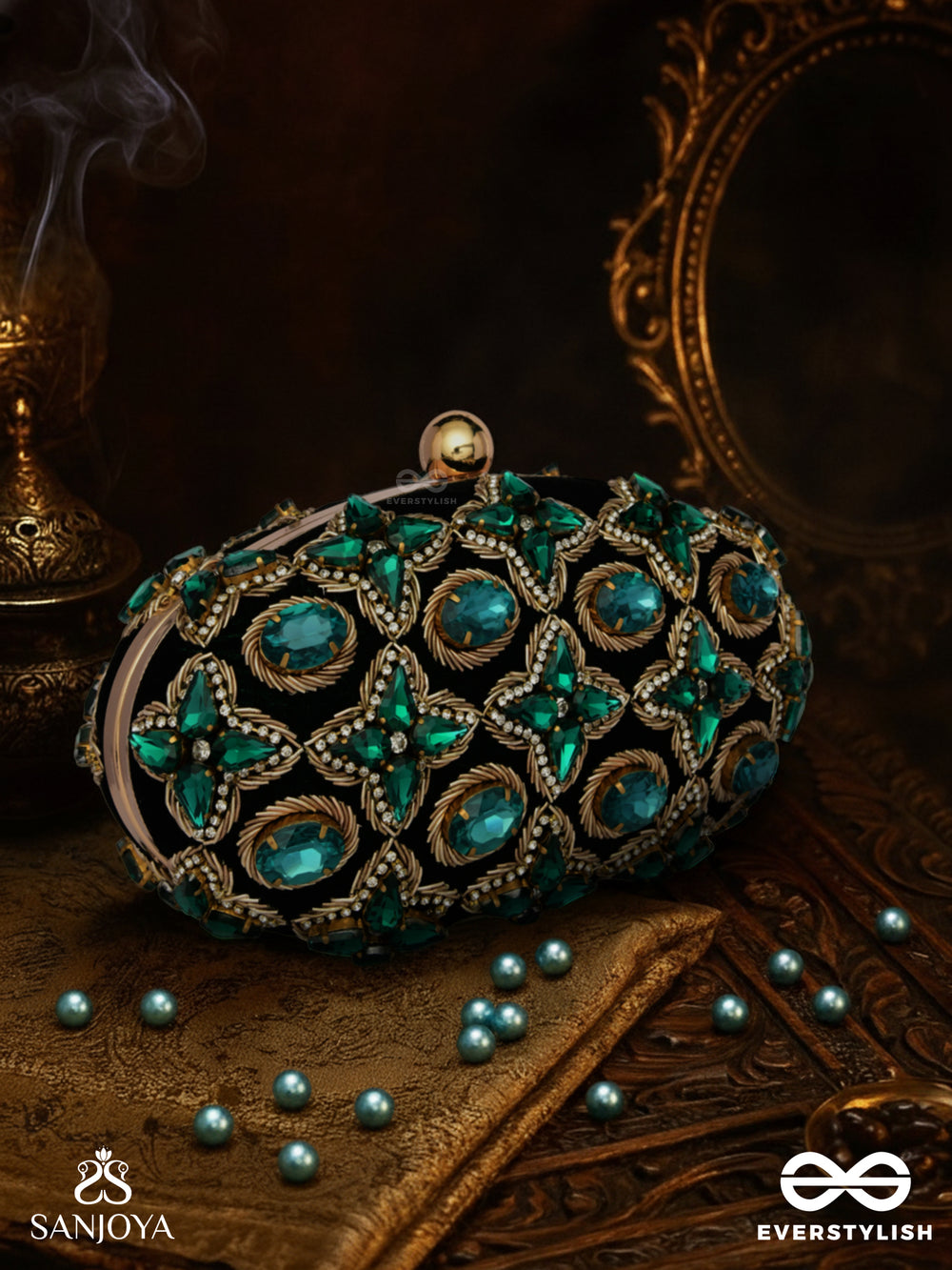 Neelzara – Oval Dark Green Velvet Clutch With Intricate Stone And Zardozi Work And Golden Metal Frame