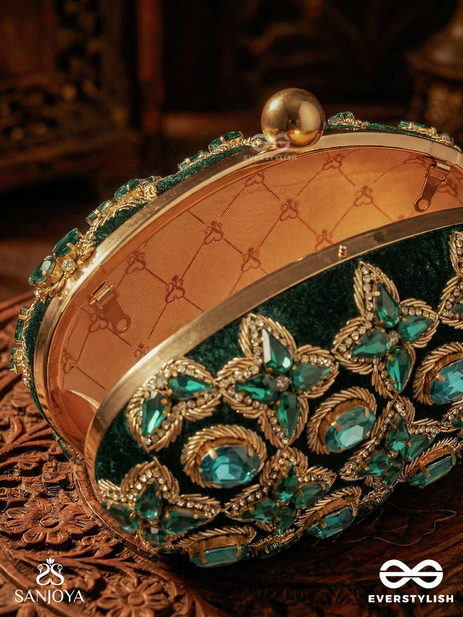 Neelzara – Oval Dark Green Velvet Clutch With Intricate Stone And Zardozi Work And Golden Metal Frame