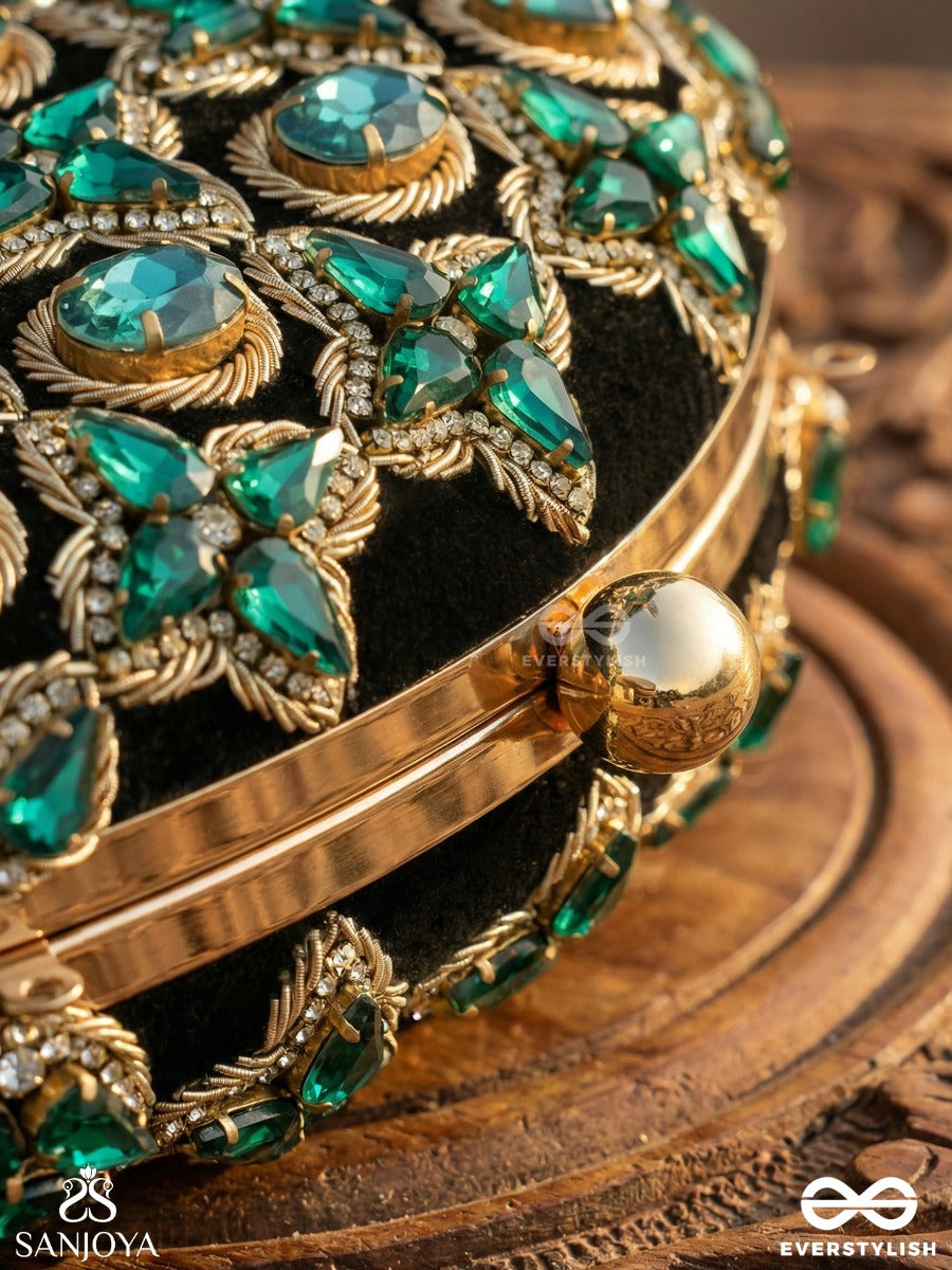 Neelzara – Oval Dark Green Velvet Clutch With Intricate Stone And Zardozi Work And Golden Metal Frame