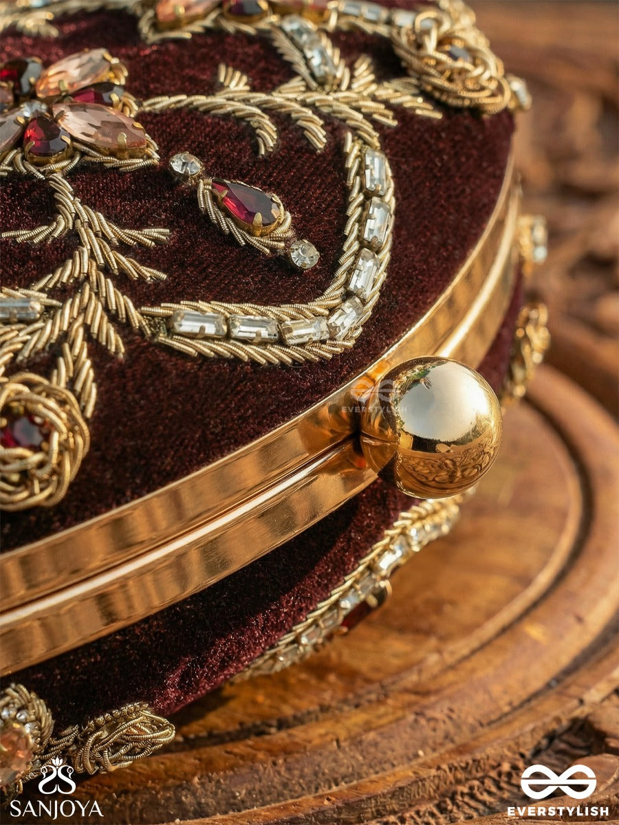 Rohini – Polished Bronze Brown Textile Clutch With Faceted Jewel Accents And Golden Metal Frame