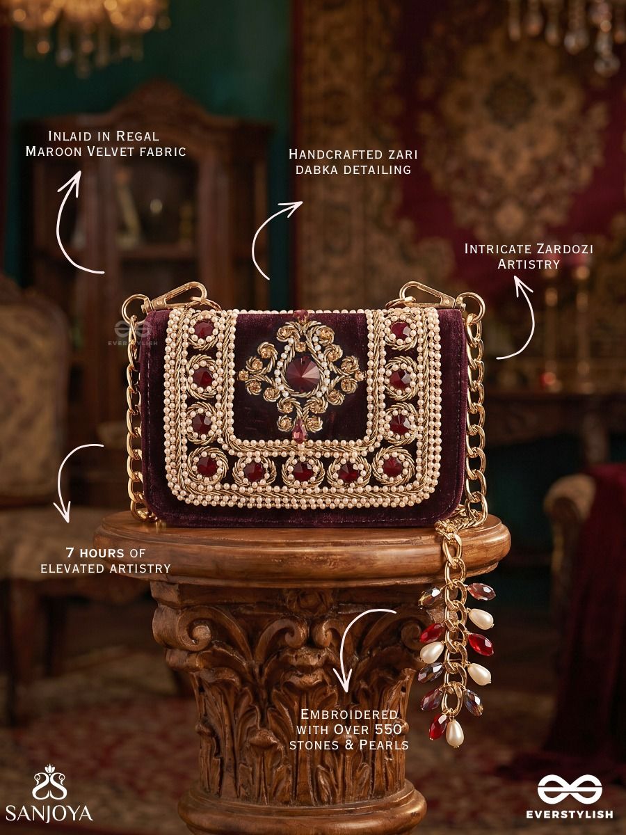 Vilasini – Rectangular Wine Velvet Clutch With Ornate Gem Embellishment, Pearl Framework And Charm Detail