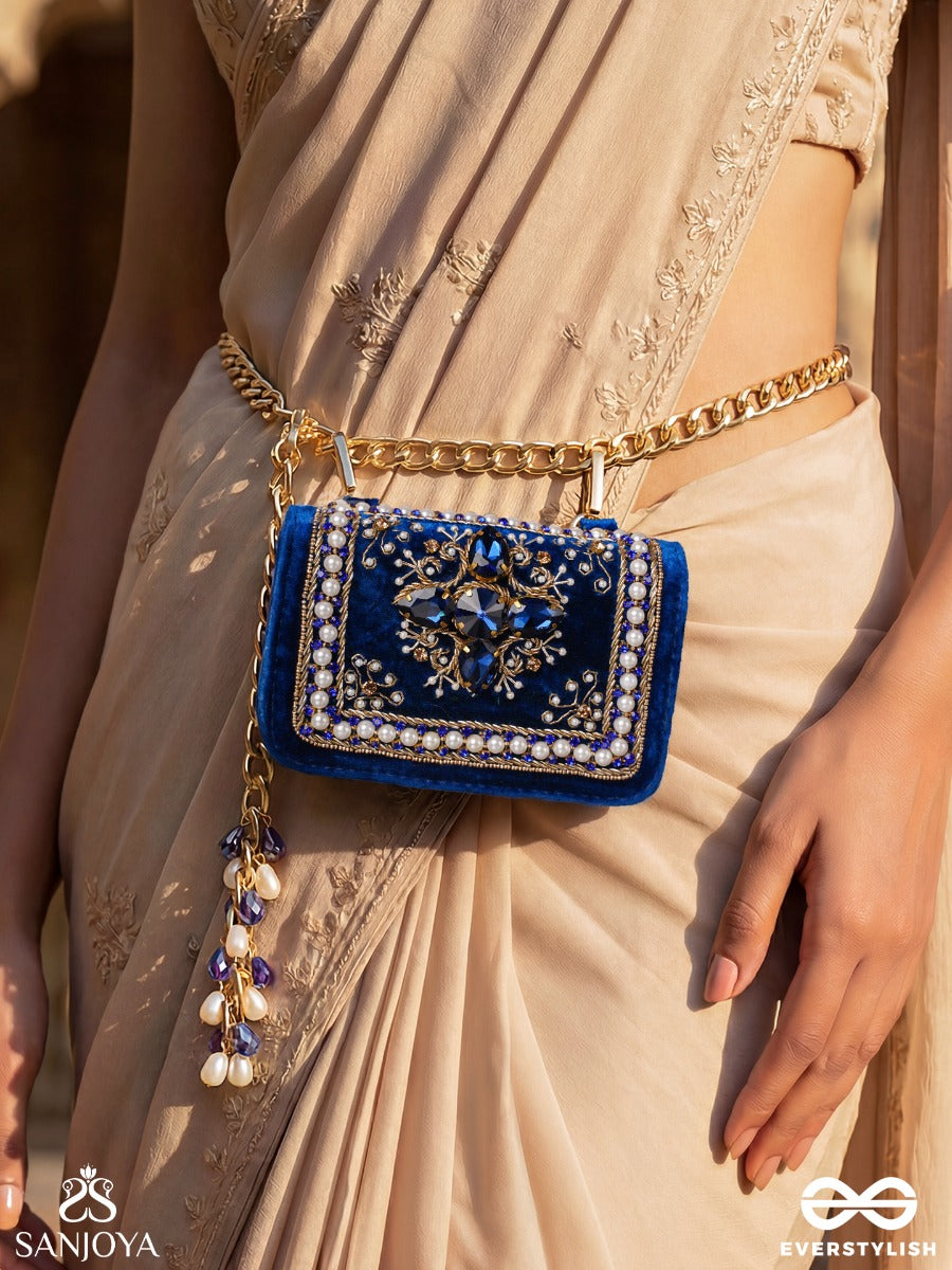 Kadambari – Rectangular Royal Blue Velvet Clutch With Ornate Gem Embellishment, Pearl Framework And Tassel Detail