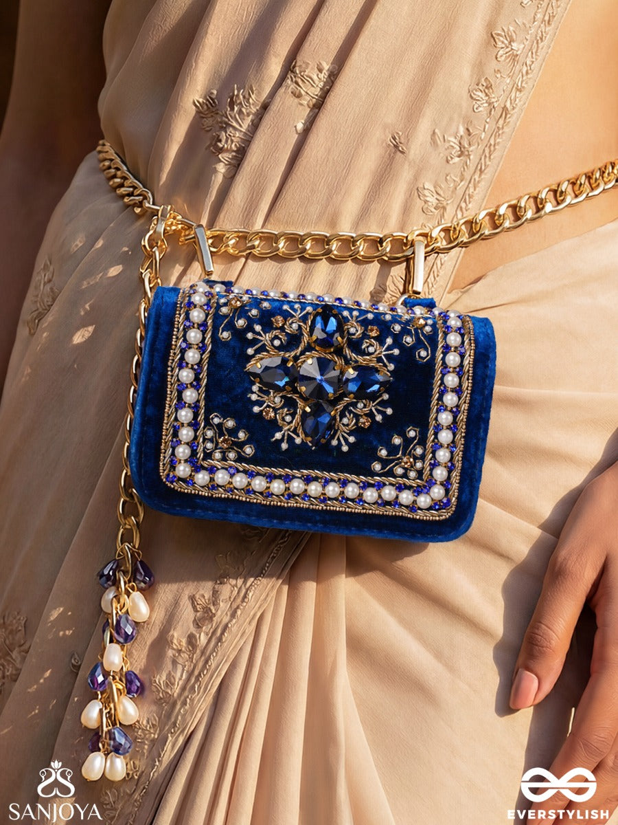 Kadambari – Rectangular Royal Blue Velvet Clutch With Ornate Gem Embellishment, Pearl Framework And Tassel Detail