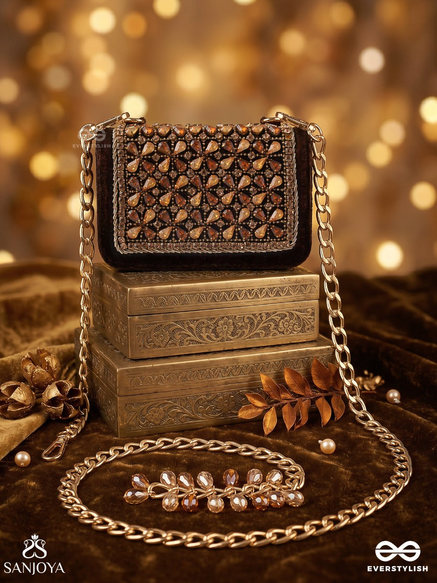 Mriganayani – Rectangular Maroon Velvet Clutch With Ornate Amber Stone Embellishment, Gold Framework And Tassel Charm