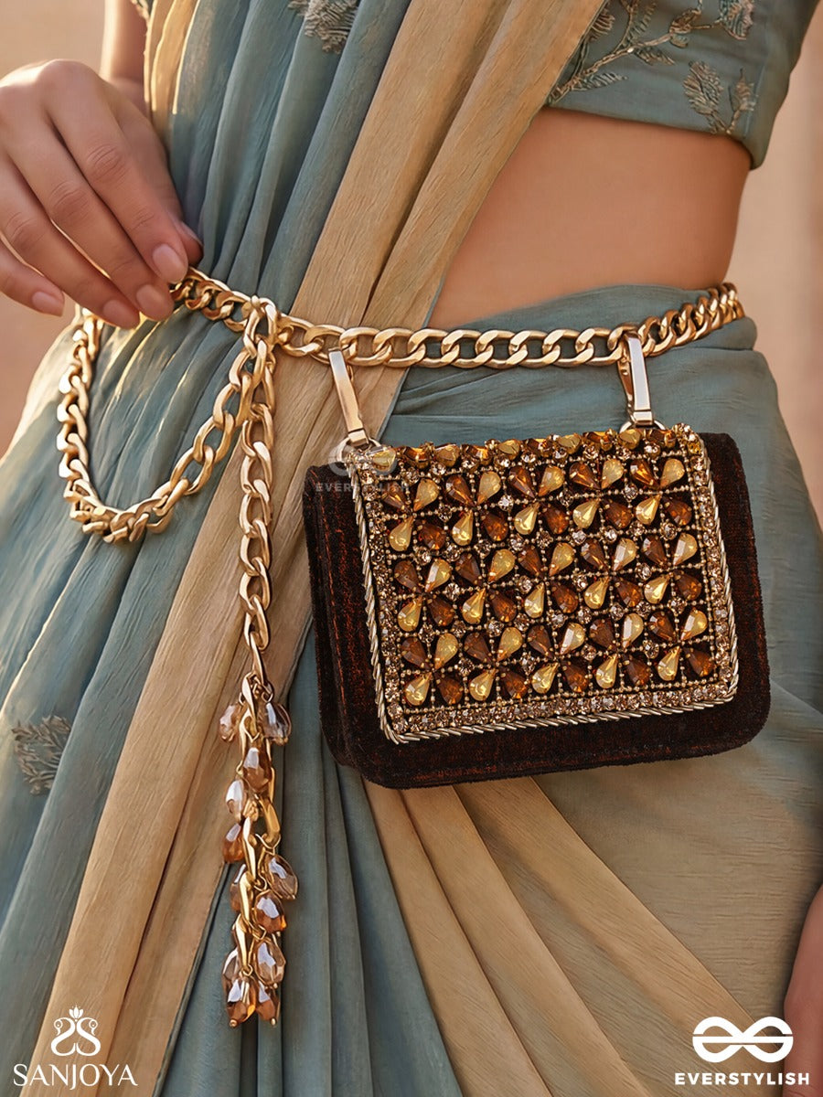 Mriganayani – Rectangular Maroon Velvet Clutch With Ornate Amber Stone Embellishment, Gold Framework And Tassel Charm
