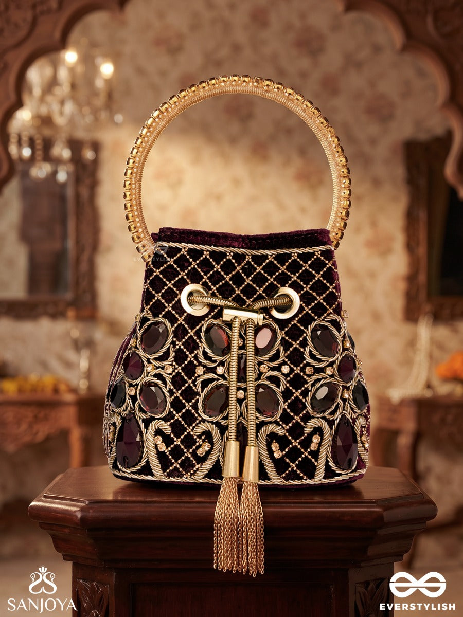 Zareen – Bucket Rich Maroon Velvet Bag With Mirror Gridwork, Braided Cord Closure And Embellished Grip Handle