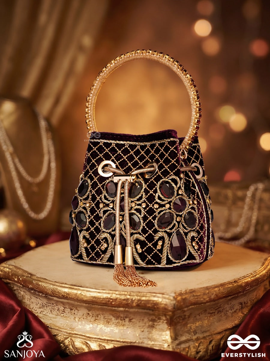 Zareen – Bucket Rich Maroon Velvet Bag With Mirror Gridwork, Braided Cord Closure And Embellished Grip Handle