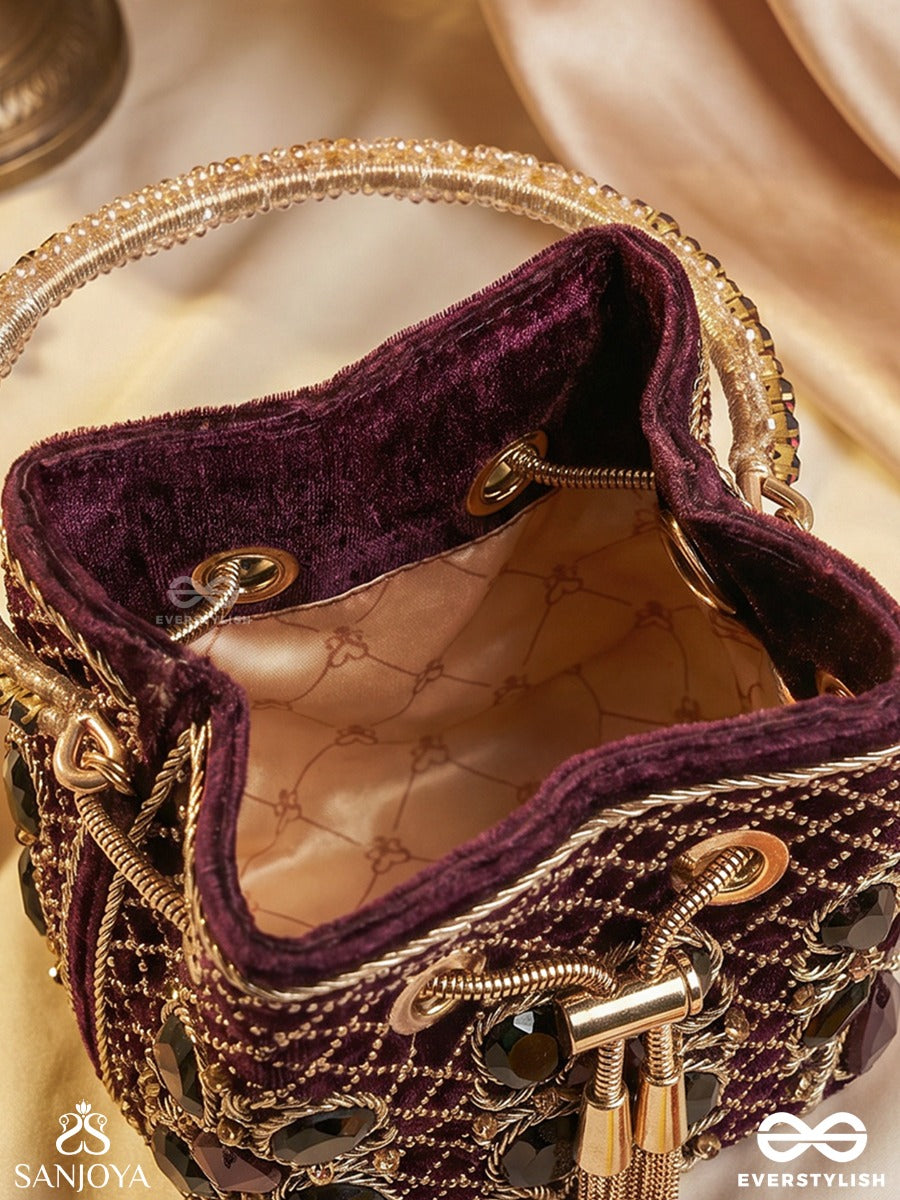 Zareen – Bucket Rich Maroon Velvet Bag With Mirror Gridwork, Braided Cord Closure And Embellished Grip Handle