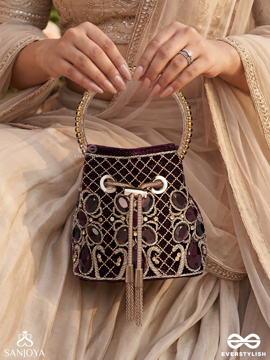 Zareen – Bucket Rich Maroon Velvet Bag With Mirror Gridwork, Braided Cord Closure And Embellished Grip Handle