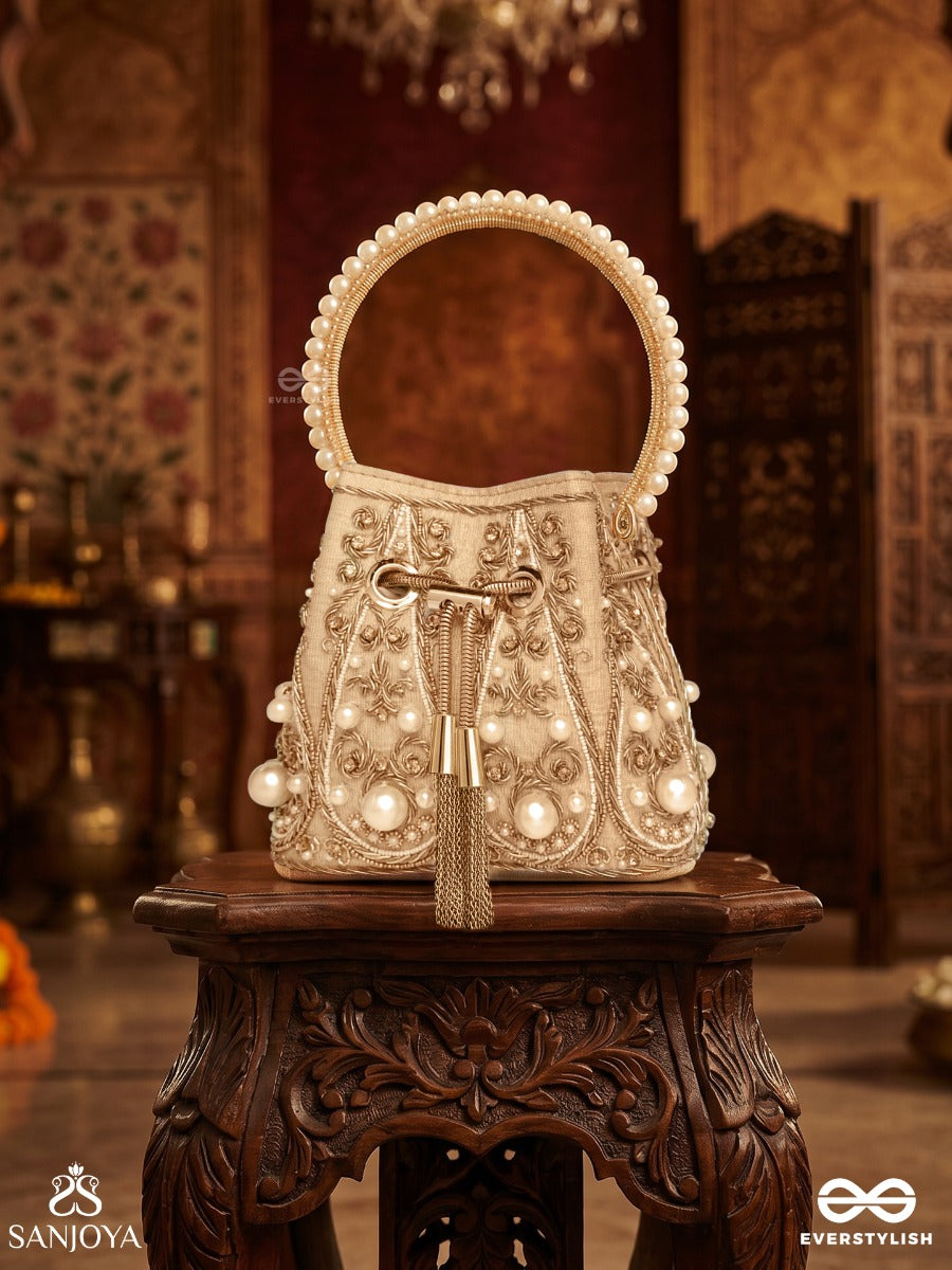 Humayra – Bucket Pale Beige Velvet Bag With Floral Pearl Work, Drawstring Closure And Decorative Ring Handle
