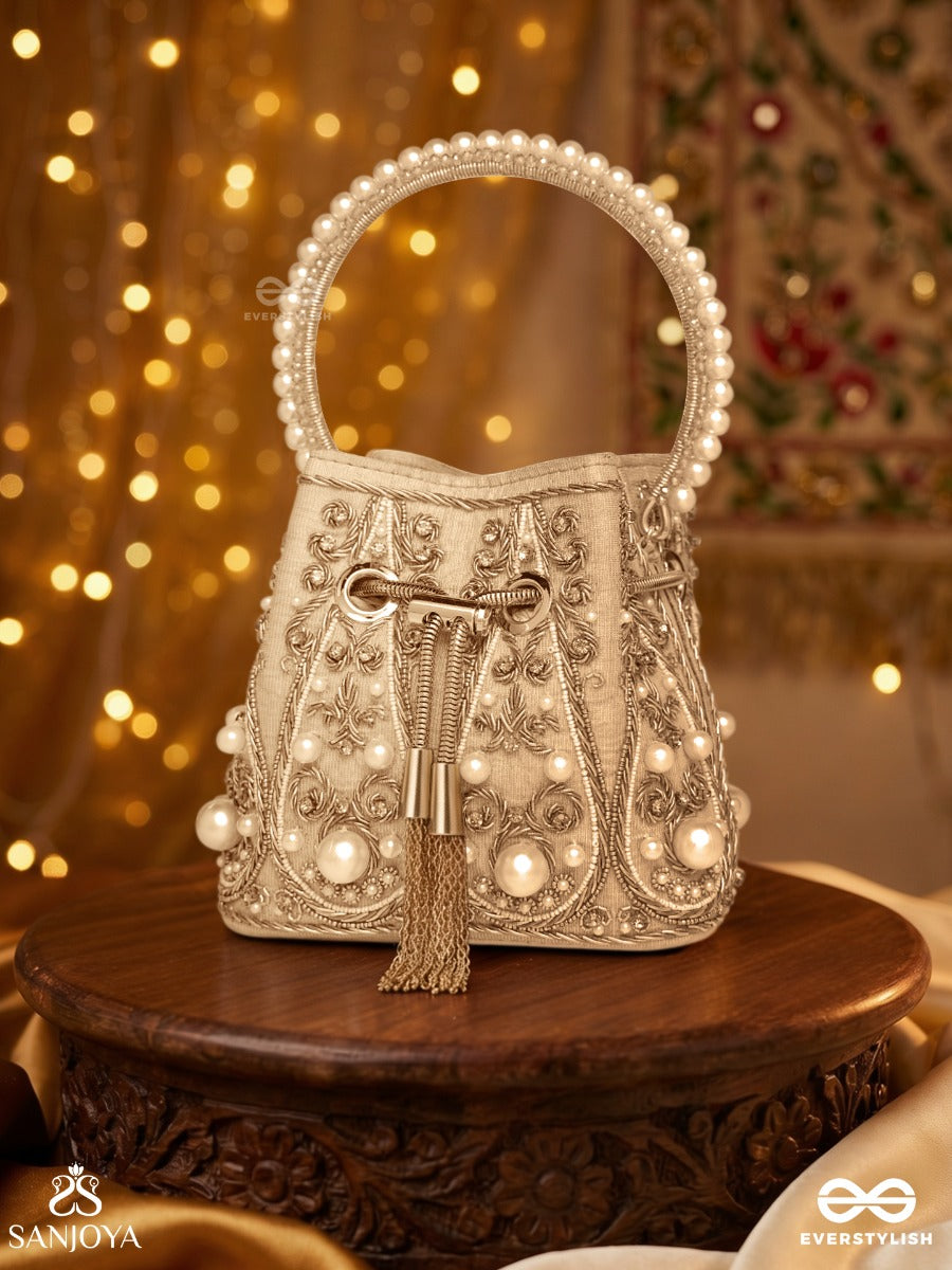 Humayra – Bucket Pale Beige Velvet Bag With Floral Pearl Work, Drawstring Closure And Decorative Ring Handle