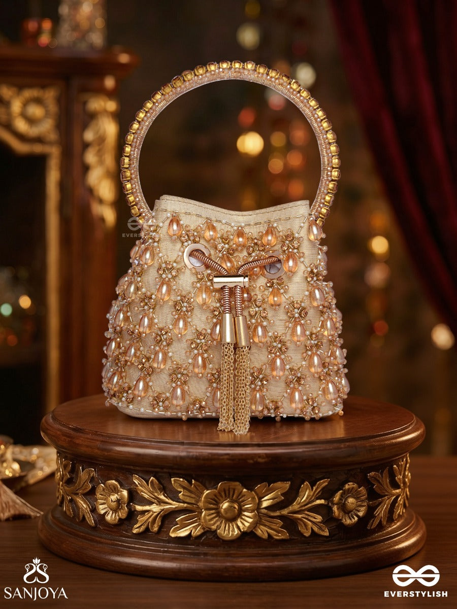 Rumana – Bucket Pale Champagne Base Bag With Cascade Pearl Detailing, Cord Lock And Embellished Handle