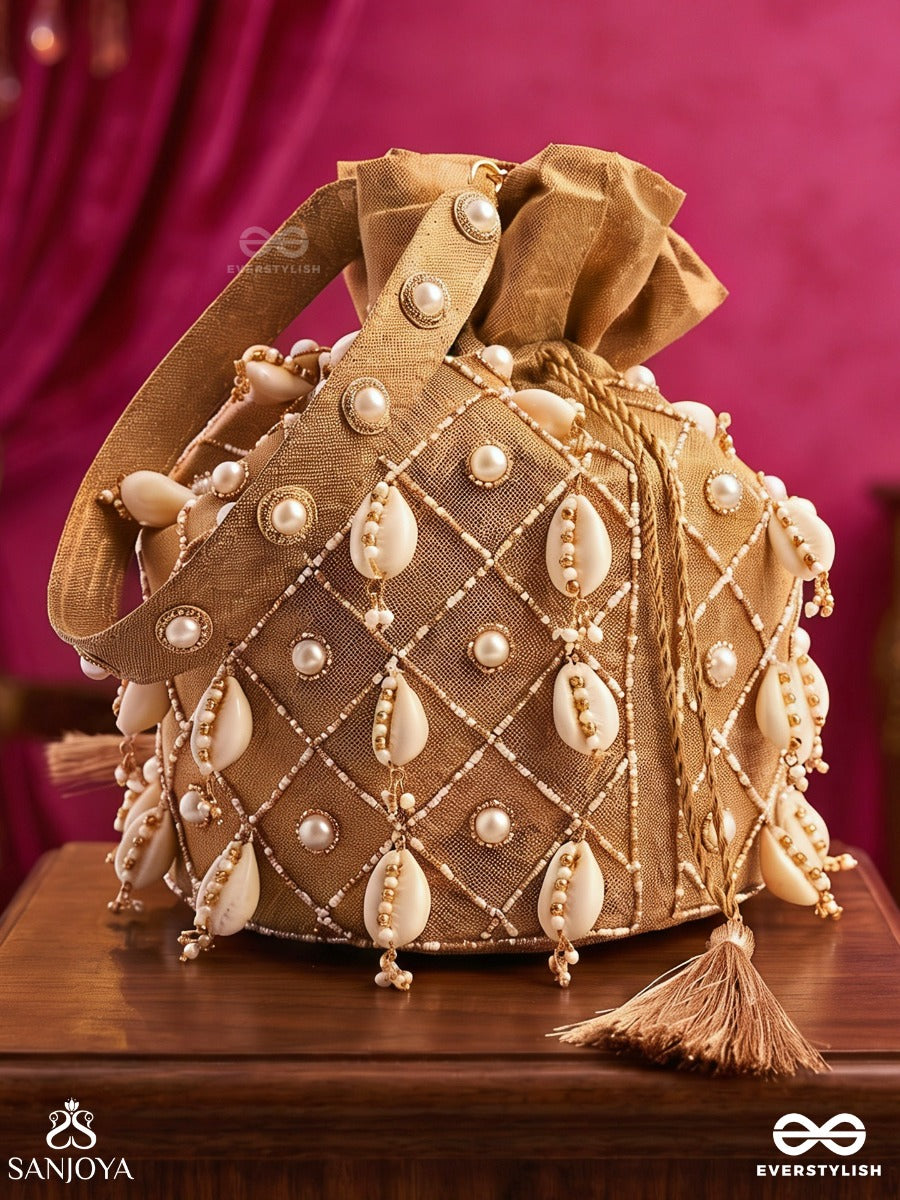 Saharish – Potli Champagne Beige Bag With Shell Embellishment, Pearl Detailing And Tassel Tie Accents