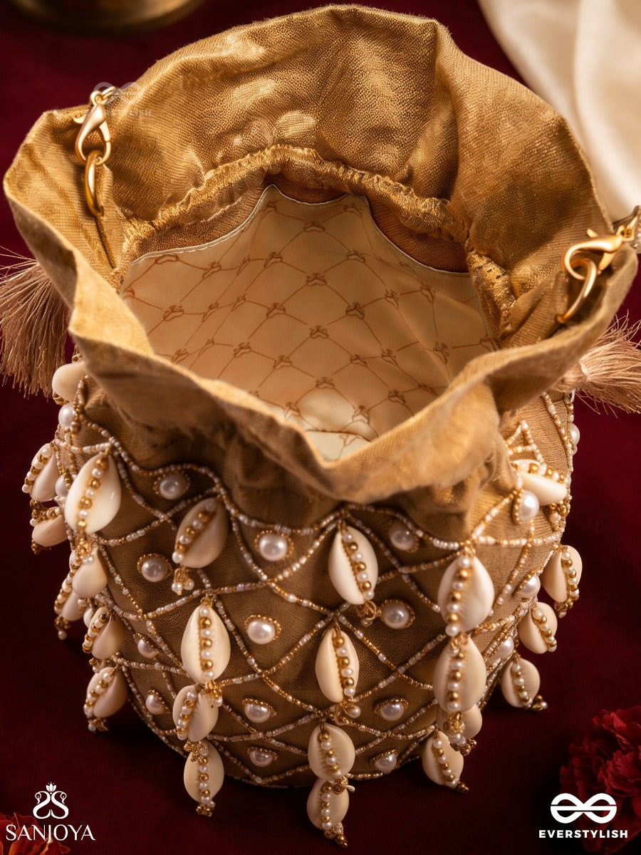 Saharish – Potli Champagne Beige Bag With Shell Embellishment, Pearl Detailing And Tassel Tie Accents