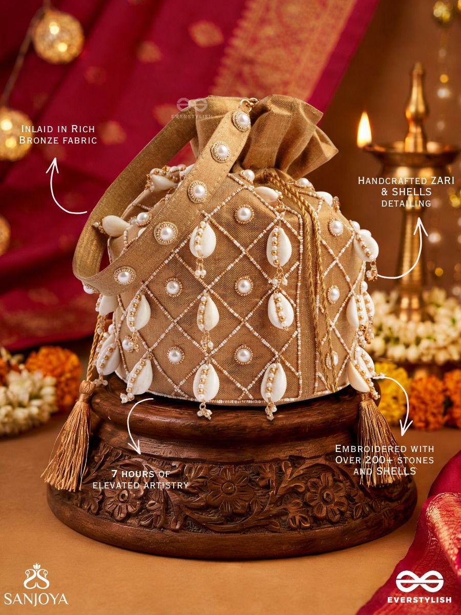Saharish – Potli Champagne Beige Bag With Shell Embellishment, Pearl Detailing And Tassel Tie Accents
