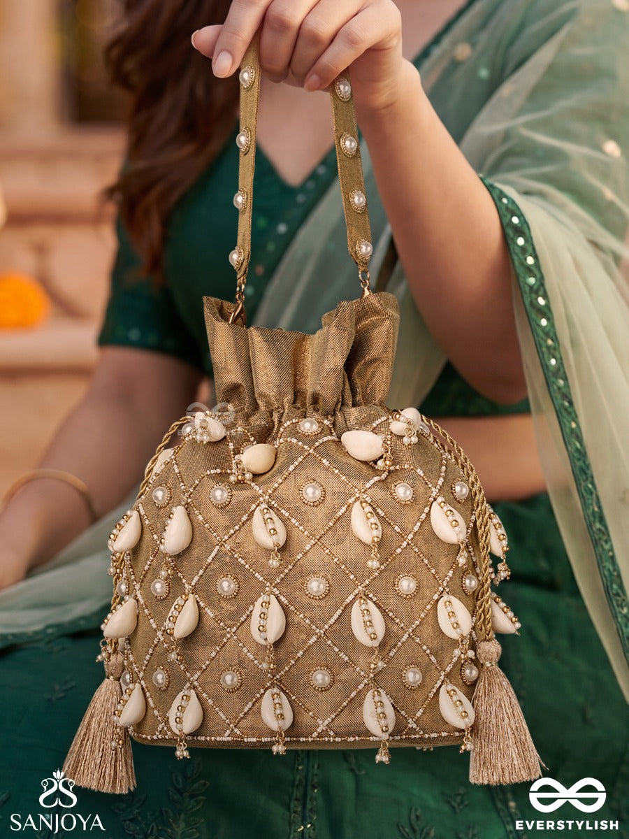 Saharish – Potli Champagne Beige Bag With Shell Embellishment, Pearl Detailing And Tassel Tie Accents