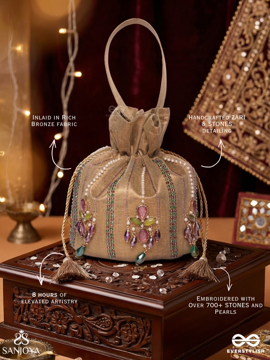 Shahgulnaar – Potli Warm Sand Bag With Jeweled Motif Work, Crystal Embellishments And Dangling Tassel Ends