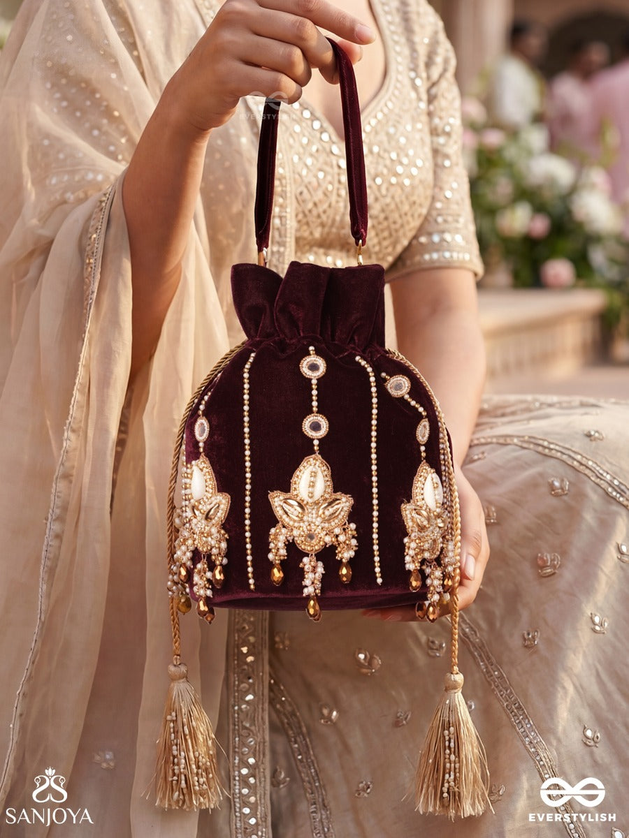 Shahzebaan – Potli Rich Wine Bag With Festive Appliqué Detailing, Pearl Highlights And Braided Tie Ends