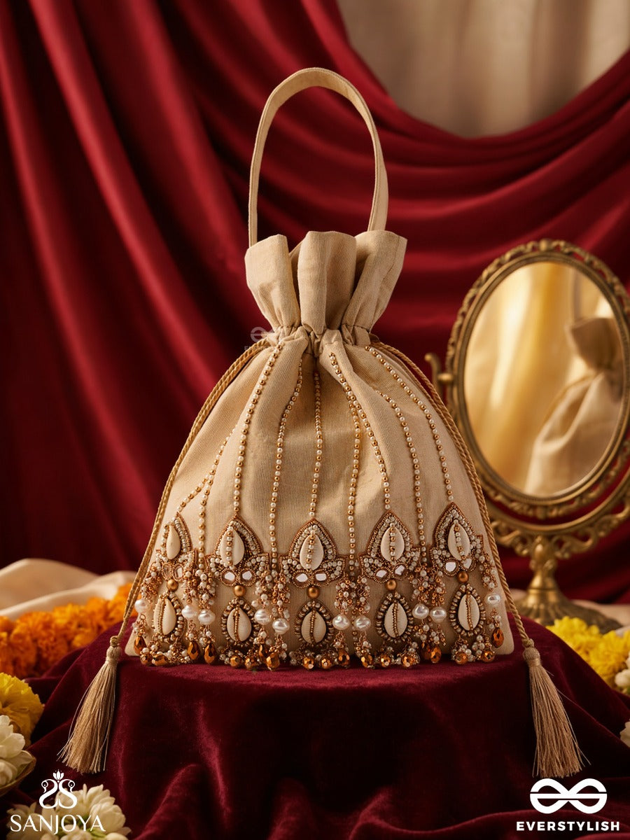 Yasmeenah – Potli Light Champagne Bag With Handplaced Pearl Hangings, Ornamental Thread Accents And Braided Ties