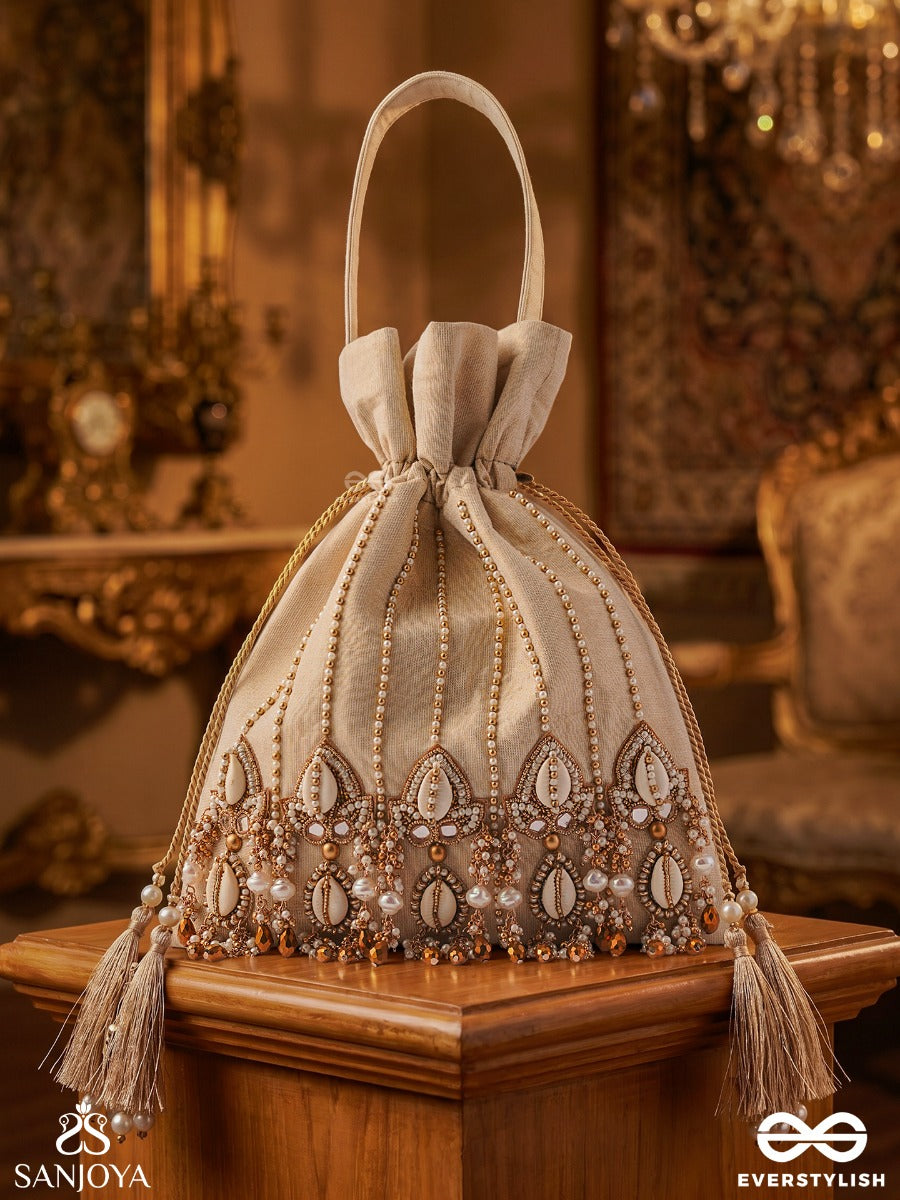Yasmeenah – Potli Light Champagne Bag With Handplaced Pearl Hangings, Ornamental Thread Accents And Braided Ties