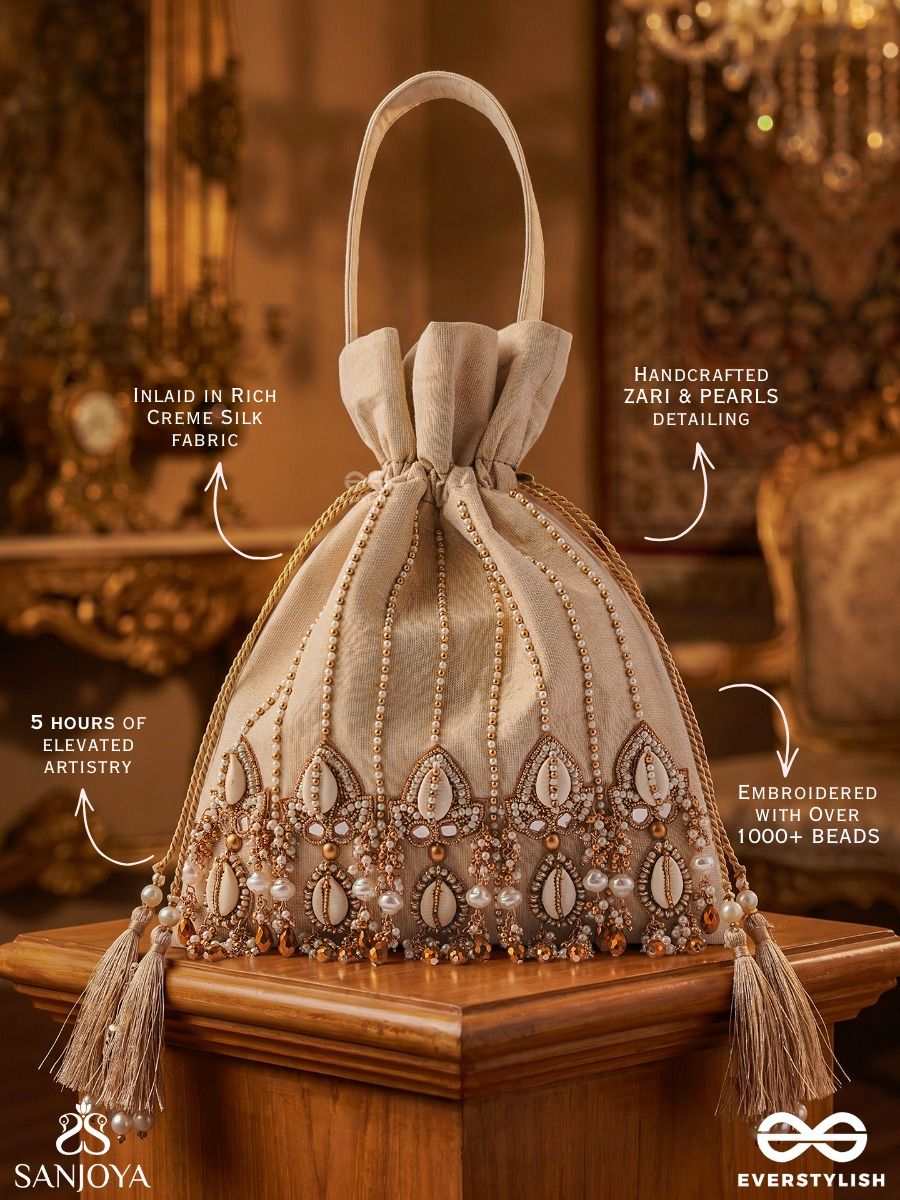 Yasmeenah – Potli Light Champagne Bag With Handplaced Pearl Hangings, Ornamental Thread Accents And Braided Ties