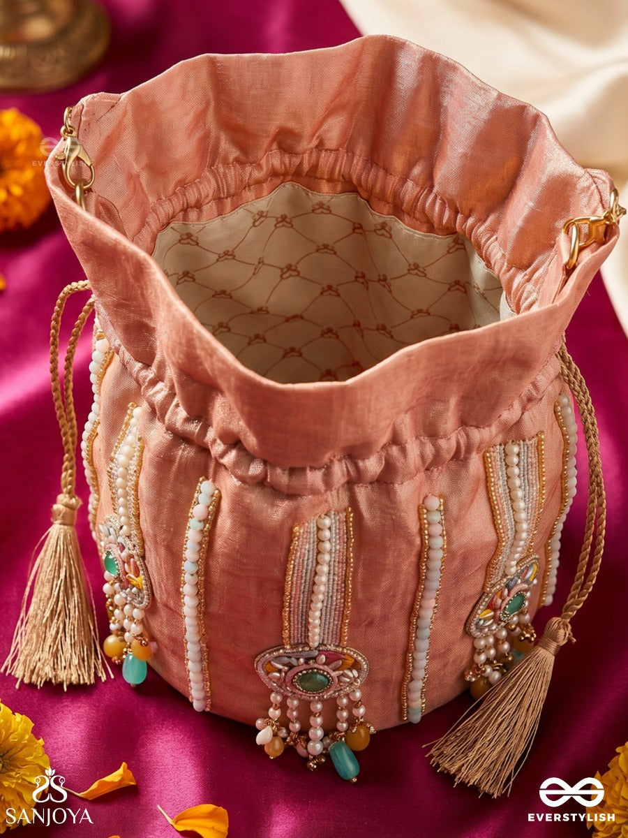 Kainaat – Potli Soft Peach Bag With Multistone Detailing, Jeweled Line Accents And Side Tassels